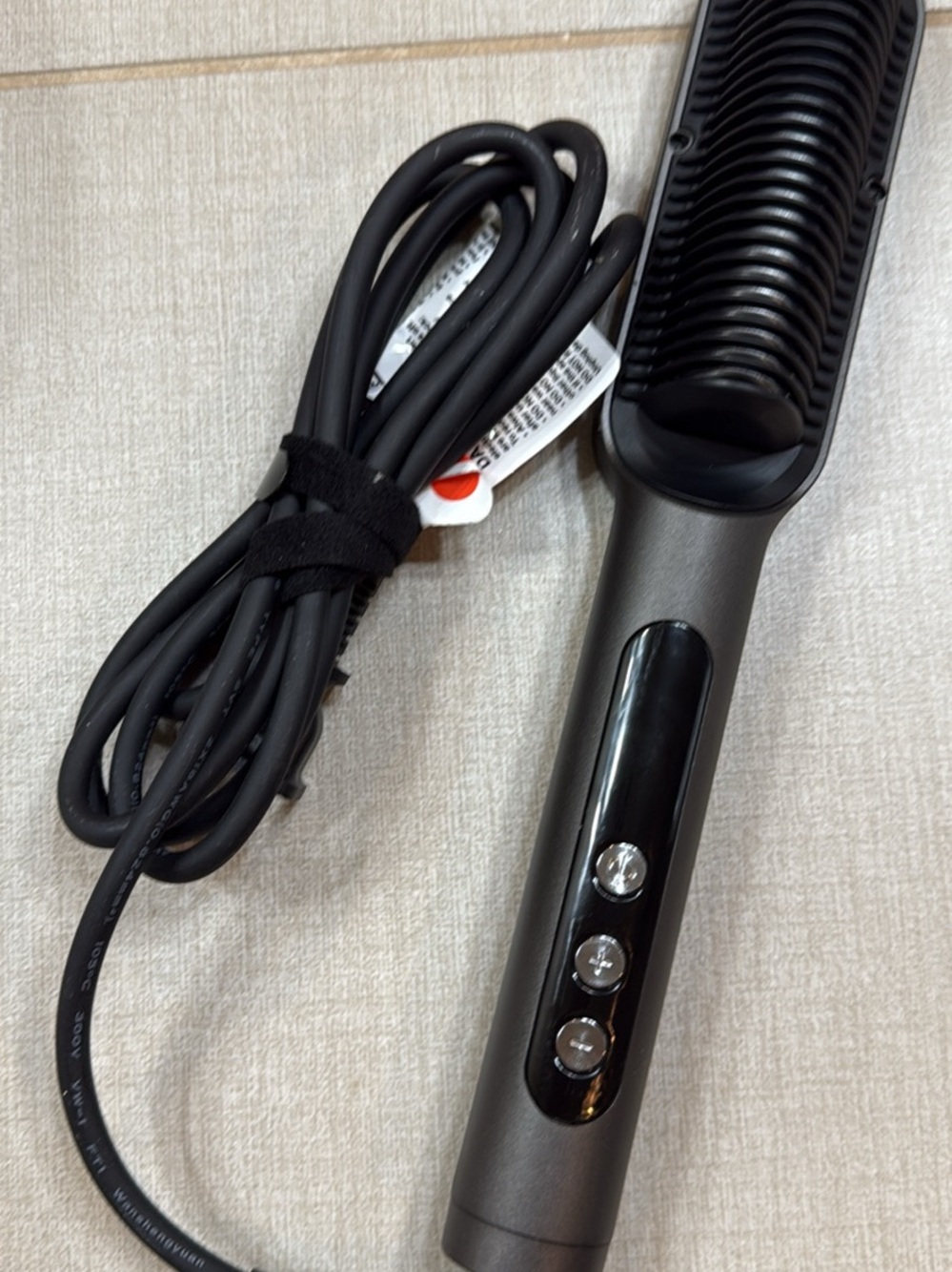 Sleek Black Heated Hair Brush for Smooth Styling